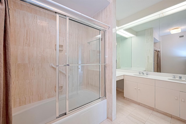 651 Bering Dr Unit 1101, Houston, TX 77057 - full bathroom with bath / shower combo with glass door, double vanity, and tile patterned flooring