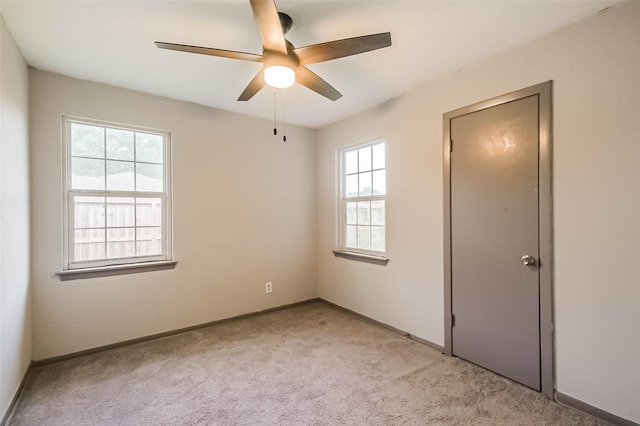 3313 Chestershire Dr, Pasadena, TX 77503 - spare room featuring light colored carpet, baseboards, and a ceiling fan