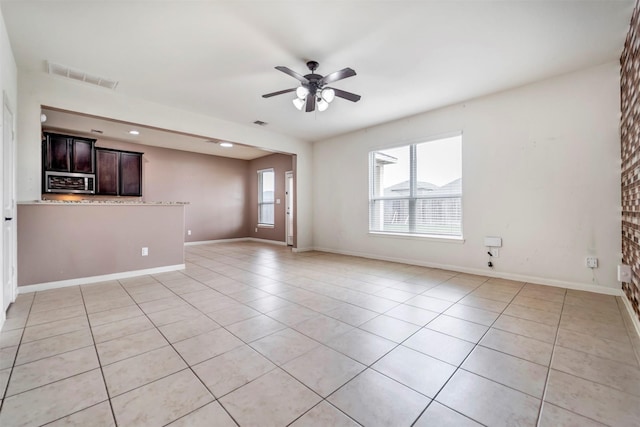 21114 Echo Manor Dr, Hockley, TX 77447 - unfurnished living room featuring light tile patterned floors, a ceiling fan, and recessed lighting