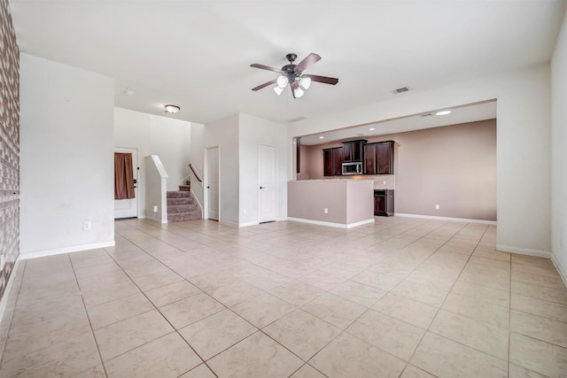 21114 Echo Manor Dr, Hockley, TX 77447 - unfurnished living room featuring light tile patterned floors, a ceiling fan, stairs, and recessed lighting