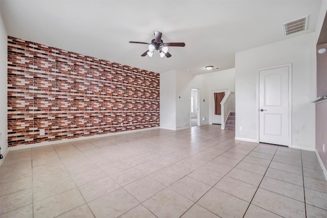 21114 Echo Manor Dr, Hockley, TX 77447 - spare room with a ceiling fan, light tile patterned floors, and stairs
