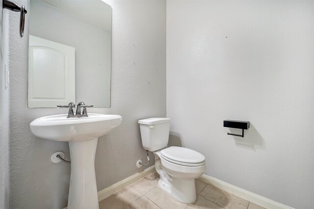 21114 Echo Manor Dr, Hockley, TX 77447 - bathroom featuring toilet and tile patterned flooring