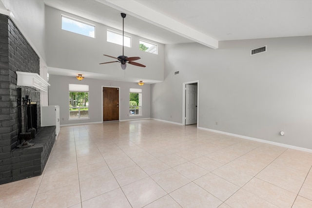 44 Foy Martin Dr, Conroe, TX 77304 - unfurnished living room with a brick fireplace, a towering ceiling, light tile patterned flooring, a ceiling fan, and beamed ceiling