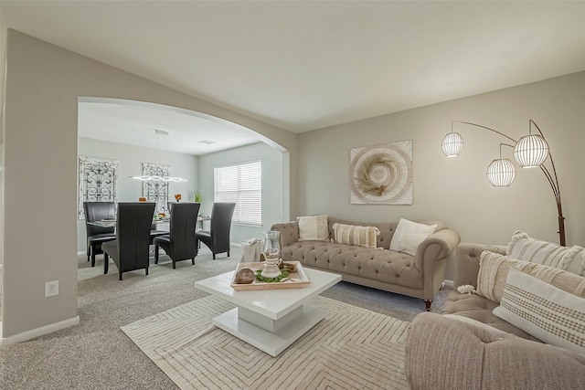 3126 Silverstag Trail Ln, Houston, TX 77073 - carpeted living room featuring arched walkways and baseboards