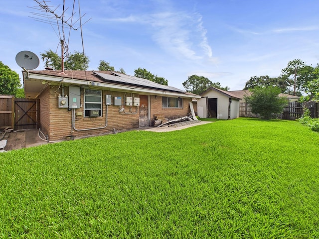 8206 Dillon St, Houston, TX 77061 - back of property featuring solar panels, a gate, brick siding, and cooling unit