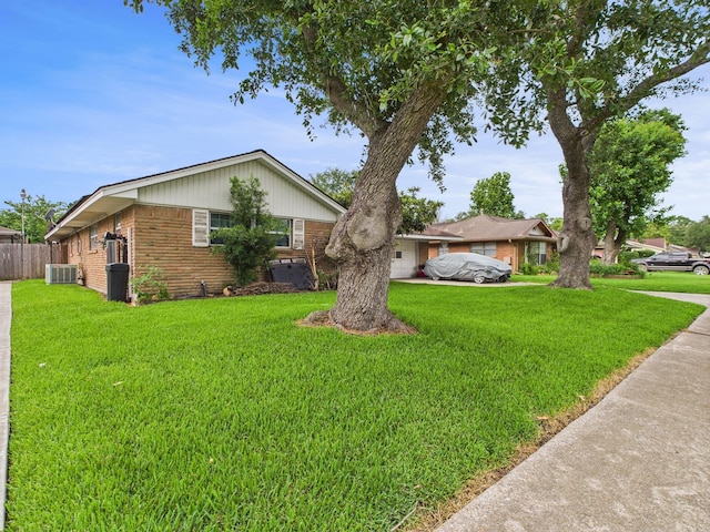 8206 Dillon St, Houston, TX 77061 - view of front of home featuring central AC unit, brick siding, and driveway
