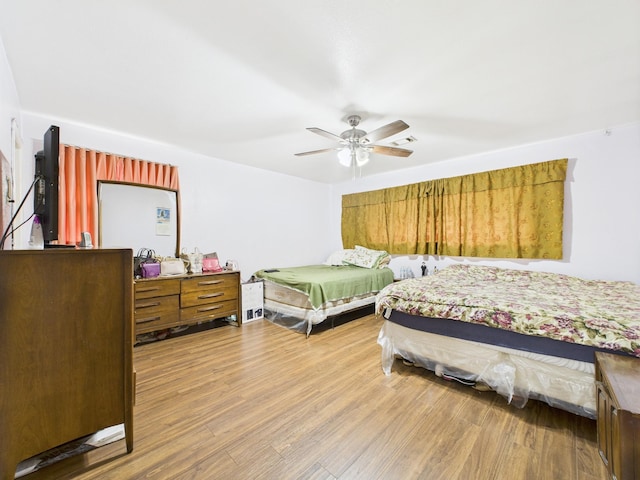 8206 Dillon St, Houston, TX 77061 - bedroom featuring wood finished floors and ceiling fan