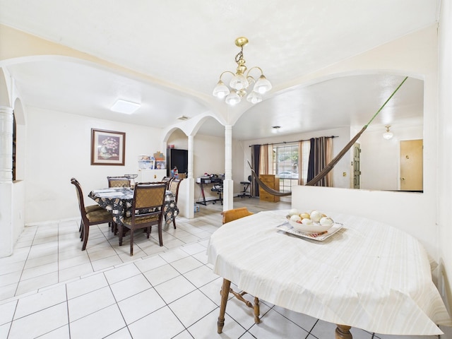 8206 Dillon St, Houston, TX 77061 - dining area featuring arched walkways, ornate columns, light tile patterned floors, and stairway