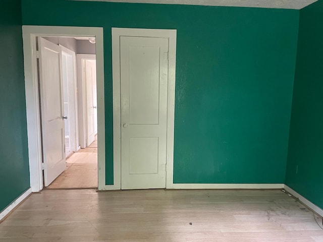514 7th St, Humble, TX 77338 - spare room with wood finished floors and baseboards