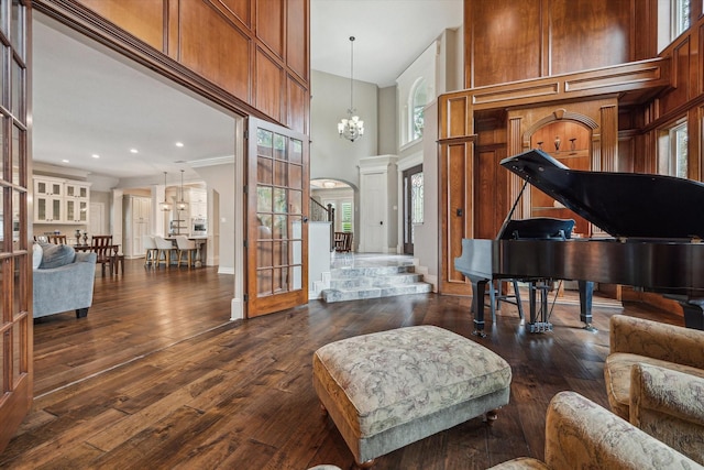 1902 Carriage Creek Ln, Friendswood, TX 77546 - foyer entrance featuring a towering ceiling, a chandelier, plenty of natural light, dark wood-style flooring, and recessed lighting