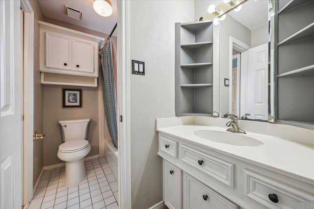 1902 Carriage Creek Ln, Friendswood, TX 77546 - full bathroom featuring vanity, toilet, tile patterned flooring, shower / tub combo, and baseboards