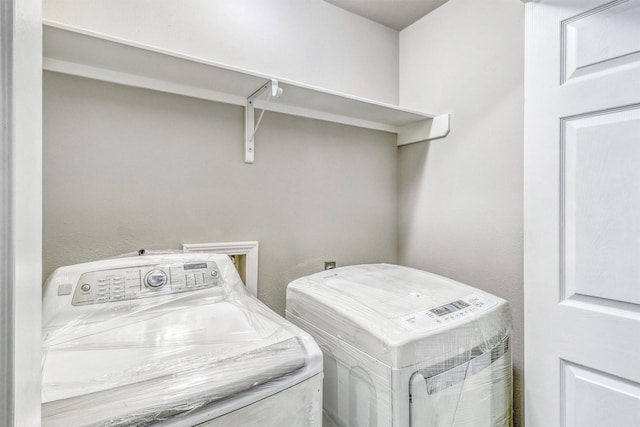 19822 Laurel Trail Dr, Cypress, TX 77433 - laundry room featuring washing machine and clothes dryer