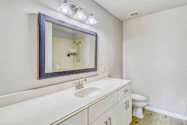 19822 Laurel Trail Dr, Cypress, TX 77433 - full bathroom featuring toilet, wood finished floors, and vanity