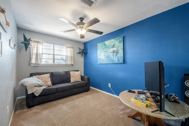 103 Jean Lafitte Cv, Galveston, TX 77554 - living room featuring carpet flooring, a ceiling fan, baseboards, and a textured ceiling