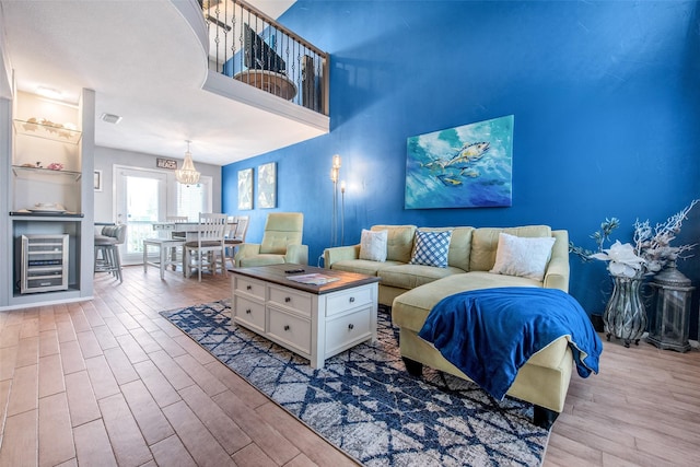 103 Jean Lafitte Cv, Galveston, TX 77554 - living area featuring beverage cooler and wood finished floors