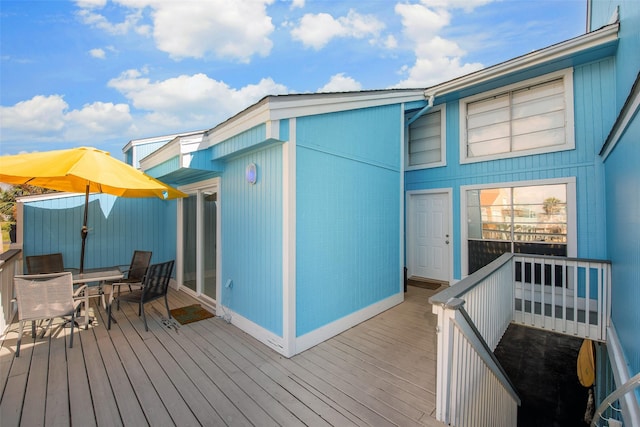 103 Jean Lafitte Cv, Galveston, TX 77554 - wooden deck with outdoor dining space