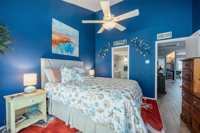 103 Jean Lafitte Cv, Galveston, TX 77554 - bedroom with wood finished floors, ensuite bath, and a ceiling fan