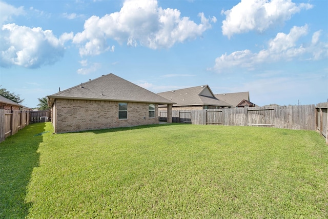 23715 Rivage Ridge Dr, Katy, TX 77493 - back of house featuring roof with shingles, brick siding, and central AC