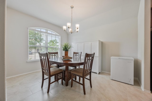 23715 Rivage Ridge Dr, Katy, TX 77493 - dining room with a chandelier, light tile patterned flooring, baseboards, and a towering ceiling