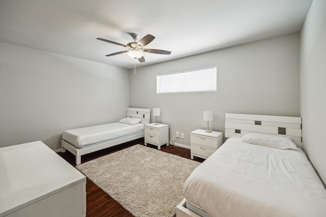 3944 W Alabama St Unit 12, Houston, TX 77027 - bedroom with dark wood finished floors, a ceiling fan, and baseboards