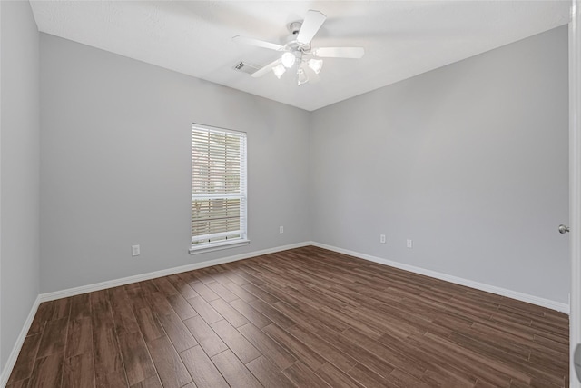 7818 Silver Lure Dr, Humble, TX 77346 - empty room featuring dark wood-style floors, baseboards, and a ceiling fan