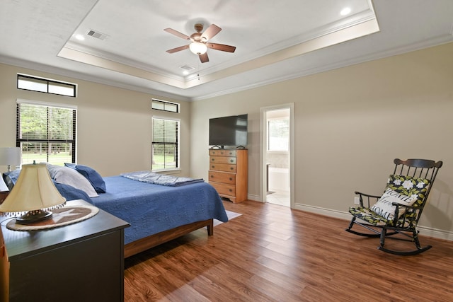 531 Private Road 6350, Dayton, TX 77535 - bedroom with a raised ceiling, crown molding, wood finished floors, connected bathroom, and recessed lighting