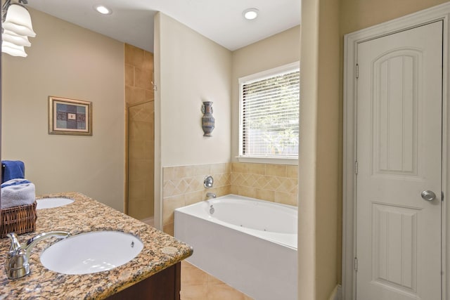531 Private Road 6350, Dayton, TX 77535 - bathroom featuring a garden tub, tile patterned flooring, double vanity, tiled shower, and recessed lighting