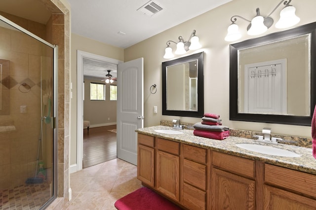 531 Private Road 6350, Dayton, TX 77535 - full bath with double vanity, a shower stall, tile patterned floors, and a ceiling fan