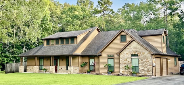 531 Private Road 6350, Dayton, TX 77535 - view of front of property featuring a porch, stone siding, roof with shingles, driveway, and view of wooded area