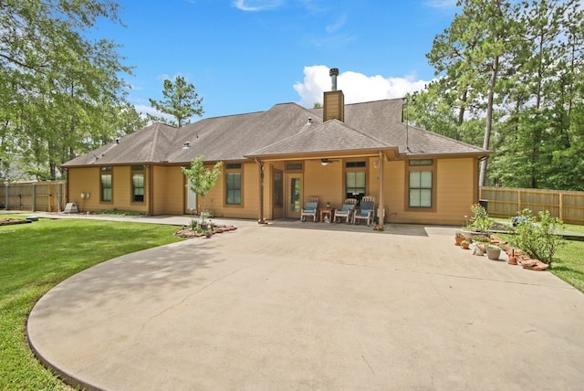 531 Private Road 6350, Dayton, TX 77535 - rear view of property with a patio and a chimney