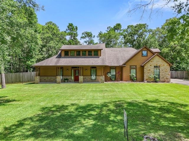 531 Private Road 6350, Dayton, TX 77535 - view of front of property featuring covered porch, a shingled roof, and stone siding