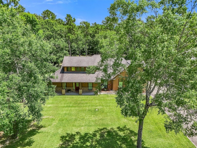 531 Private Road 6350, Dayton, TX 77535 - view of front of home with a front yard, a porch, and roof with shingles