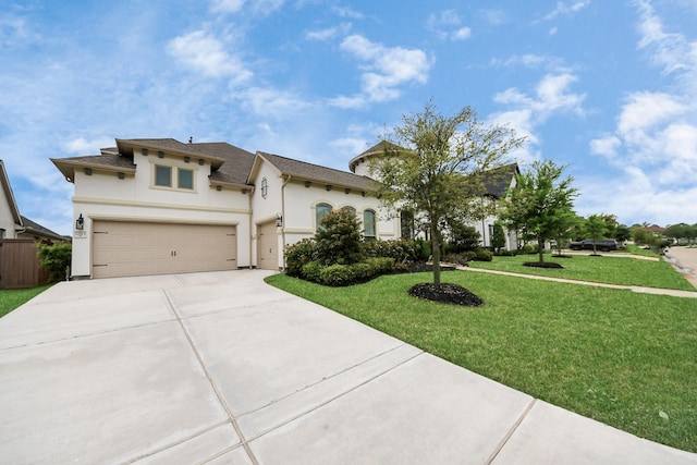 12813 N Palomino Lake Cir, Cypress, TX 77429 - view of front of home with driveway, stucco siding, a front lawn, and a garage