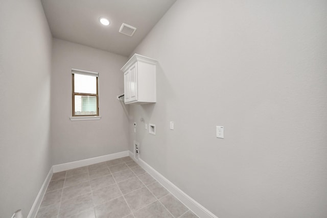 12813 N Palomino Lake Cir, Cypress, TX 77429 - laundry area featuring cabinet space, electric dryer hookup, gas dryer hookup, hookup for a washing machine, and light tile patterned floors