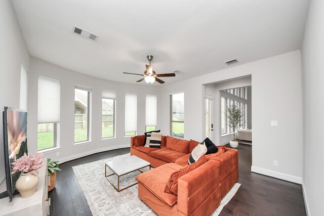 12813 N Palomino Lake Cir, Cypress, TX 77429 - living room featuring baseboards, ceiling fan, and dark wood-style flooring