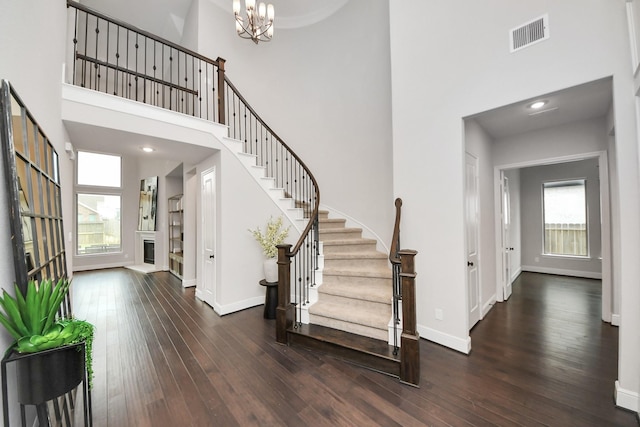 12813 N Palomino Lake Cir, Cypress, TX 77429 - entryway with a towering ceiling, stairway, hardwood / wood-style flooring, a chandelier, and baseboards