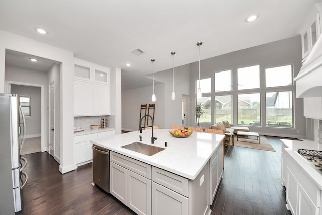 12813 N Palomino Lake Cir, Cypress, TX 77429 - kitchen featuring stainless steel appliances, a sink, dark wood-style floors, glass insert cabinets, and recessed lighting
