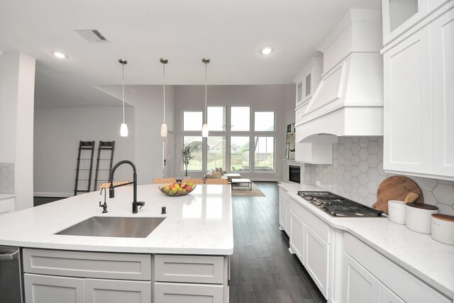 12813 N Palomino Lake Cir, Cypress, TX 77429 - kitchen featuring a sink, stainless steel appliances, decorative backsplash, recessed lighting, and pendant lighting