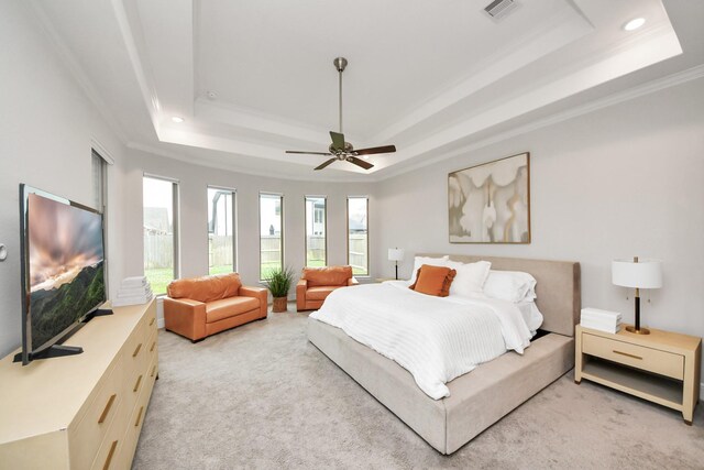 12813 N Palomino Lake Cir, Cypress, TX 77429 - bedroom with a tray ceiling, crown molding, light carpet, ceiling fan, and recessed lighting
