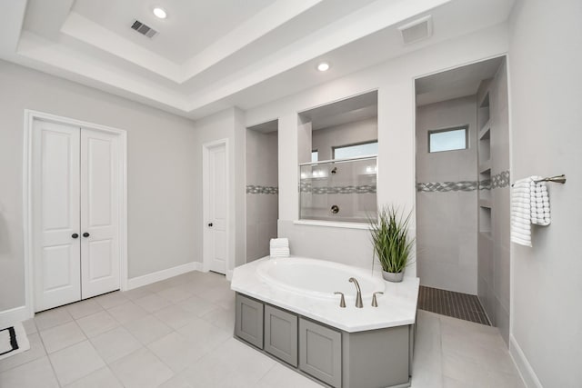 12813 N Palomino Lake Cir, Cypress, TX 77429 - bathroom featuring a bath, a walk in shower, tile patterned flooring, recessed lighting, and baseboards