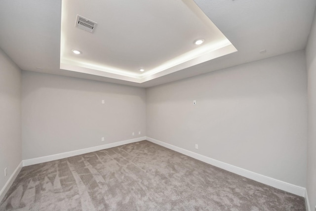 12813 N Palomino Lake Cir, Cypress, TX 77429 - spare room featuring recessed lighting, a raised ceiling, baseboards, and carpet floors