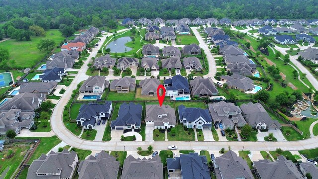 12813 N Palomino Lake Cir, Cypress, TX 77429 - view of property location featuring nearby suburban area, a large body of water, and a heavily wooded area