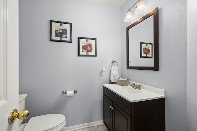 9715 Therrell Dr, Houston, TX 77064 - half bath with vanity, toilet, tile patterned floors, and baseboards