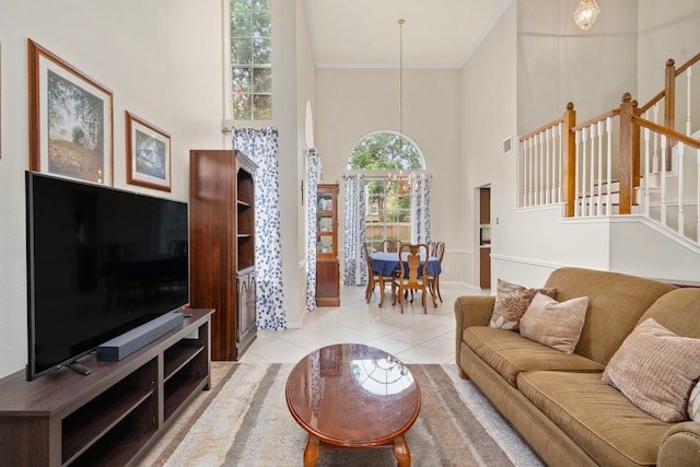 9715 Therrell Dr, Houston, TX 77064 - tiled living room featuring a high ceiling, stairway, crown molding, and baseboards