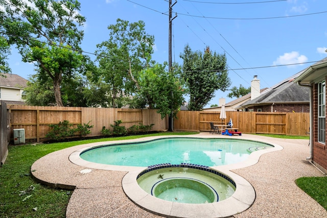 9715 Therrell Dr, Houston, TX 77064 - view of pool with a pool with connected hot tub, a fenced backyard, and a patio