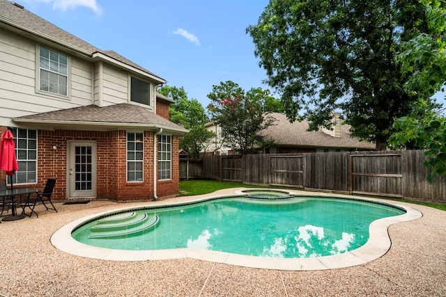 9715 Therrell Dr, Houston, TX 77064 - view of pool with a fenced backyard, a patio, and a pool with connected hot tub