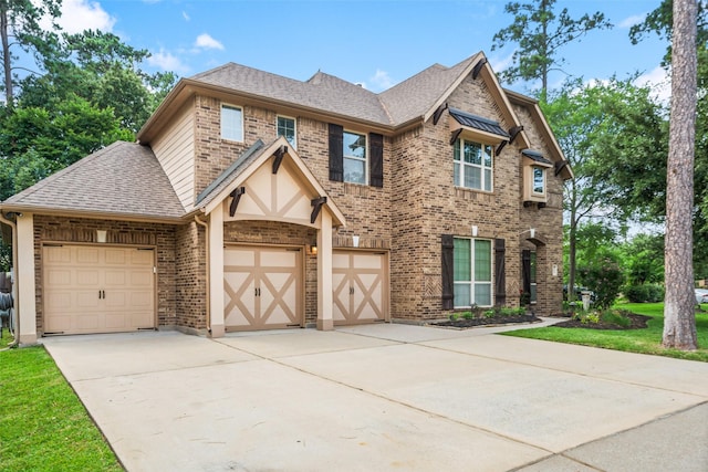 20 Camden Oaks Ln, Montgomery, TX 77356 - view of front of property featuring a shingled roof, brick siding, driveway, and a garage
