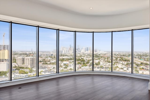 1701 Hermann Dr Unit 27Ce, Houston, TX 77004 - unfurnished room with a city view and wood finished floors