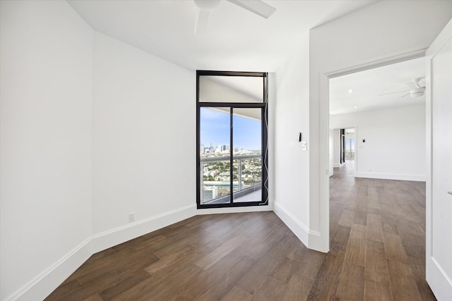 1701 Hermann Dr Unit 27Ce, Houston, TX 77004 - spare room featuring ceiling fan, dark wood-style flooring, and baseboards