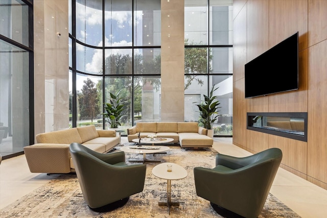 1701 Hermann Dr Unit 27Ce, Houston, TX 77004 - community lobby with a wall of windows, a high ceiling, and wood walls